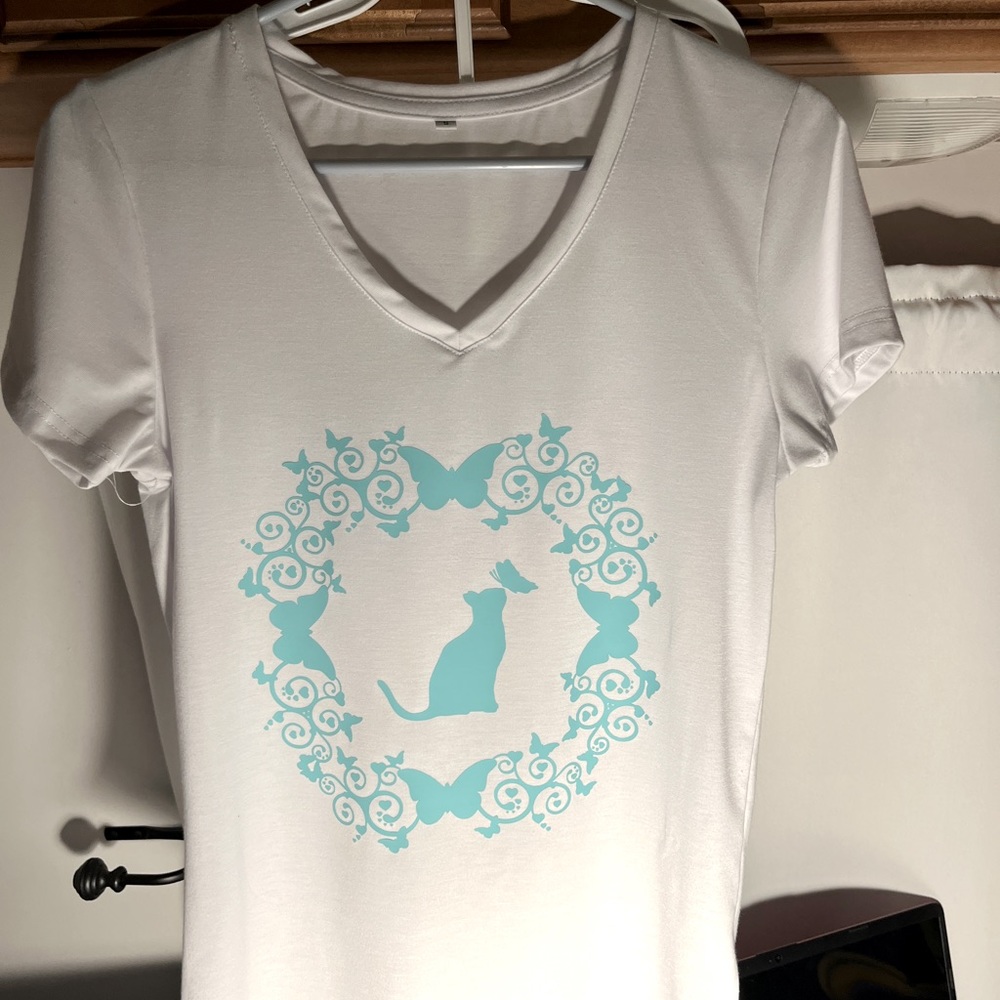 White V-Neck with added design shirt.